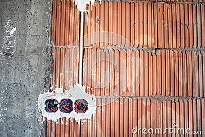 Wall sockets, electricity installation at house construction site Stock Photo