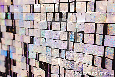 a wall of squares of shiny sequins. an element of decor for a holiday Stock Photo