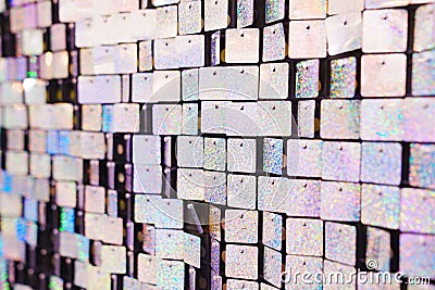 a wall of squares of shiny sequins. an element of decor for a holiday Stock Photo