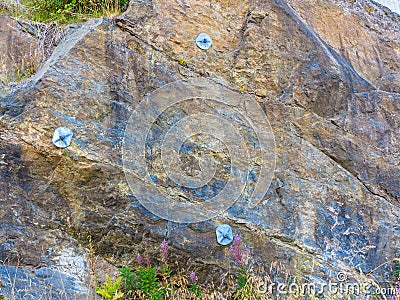 Wall stone solid nature rock with construction steel Stock Photo