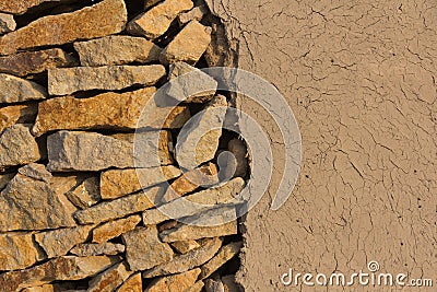 Wall of stones and loam Stock Photo