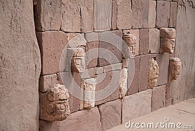 Wall in Tiahuanaco with stone faces Stock Photo