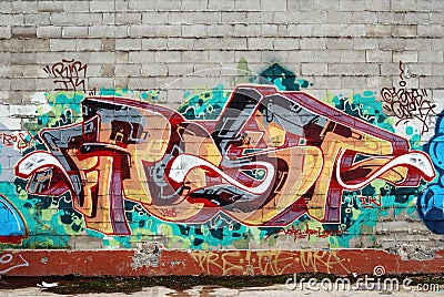 A wall vandalized with street graffiti art Editorial Stock Photo