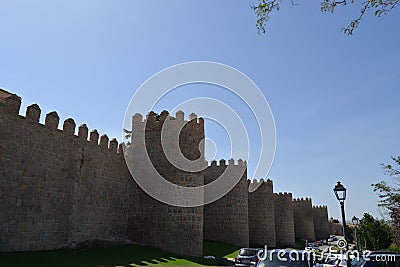 The wall of Ãvila is a Romanesque military fence that surrounds the old quarter of the Spanish city of Ãvila Editorial Stock Photo