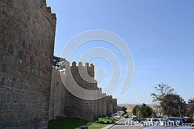 The wall of Ãvila is a Romanesque military fence that surrounds the old quarter of the Spanish city of Ãvila Editorial Stock Photo