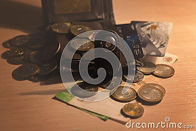 Wallet and cash lying on the table Stock Photo