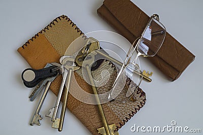 Wallet of leather scraps and a bunch of keys Stock Photo