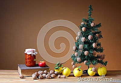 Wallnuts and quinces with a pine tree Stock Photo
