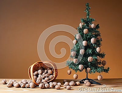 Wallnuts in a wicker basket with a pine tree Stock Photo