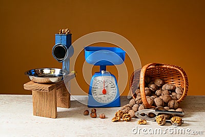 Wallnuts in a wicker basket with scales Stock Photo