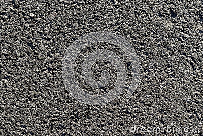 Textured asphalt texture with gray holes Stock Photo