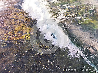 Wallpaper wave over coral reef roof Stock Photo