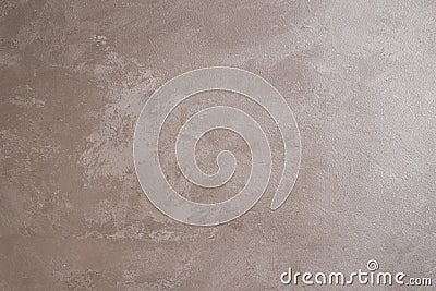 The walls are decorated with Venetian decorative plaster with a gray, shiny beige tint of paint. Background, abstraction Stock Photo