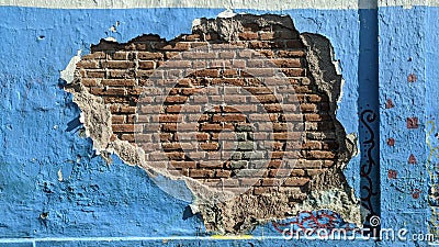 The walls were peeling off showing the bricks inside. Stock Photo