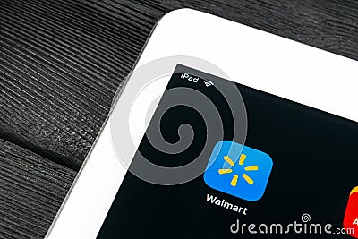 Walmart application icon on Apple iPad Pro screen close-up. Walmart app icon. Walmart.com is multinational retailing corporation Editorial Stock Photo