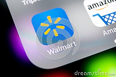 Walmart application icon on Apple iPhone X screen close-up. Walmart app icon. Walmart.com is multinational retailing corporation Editorial Stock Photo