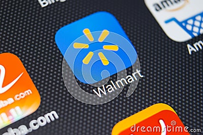 Walmart application icon on Apple iPhone X screen close-up. Walmart app icon. Walmart.com is multinational retailing corporation Editorial Stock Photo