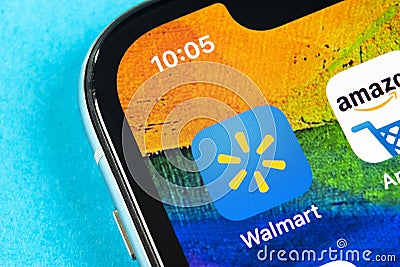 Walmart application icon on Apple iPhone X screen close-up. Walmart app icon. Walmart.com is multinational retailing corporation Editorial Stock Photo