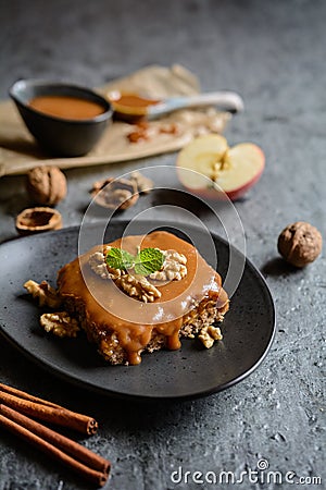 Walnut cake with grated apple layer and caramel toping Stock Photo