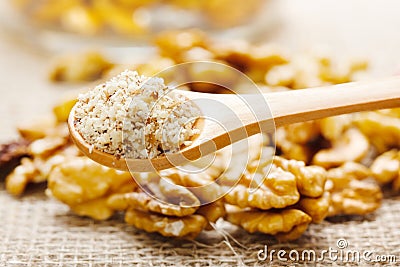 Walnut greound, nutmeat in background Stock Photo