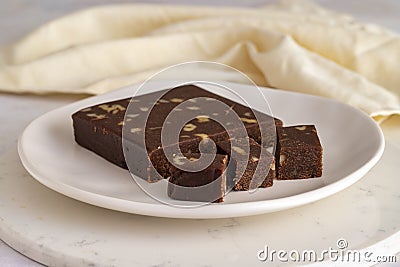 Walnut halva. Halva on whire background. Close up Stock Photo