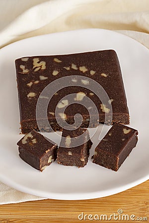 Walnut halva. Halva on wooden background. Story format Stock Photo