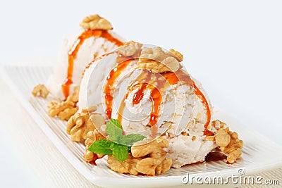 Walnut ice cream with caramel sauce Stock Photo