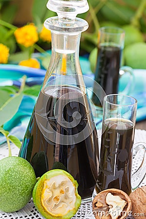 Walnut liqueur with green walnuts Stock Photo