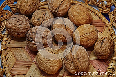 Walnuts in a basket. Harvest nuts. Golden autumn Stock Photo