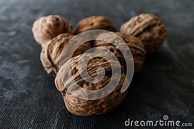 Walnuts closeup over dark background Stock Photo