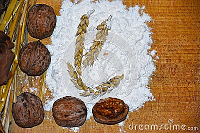 Walnuts, flour and wheat Stock Photo