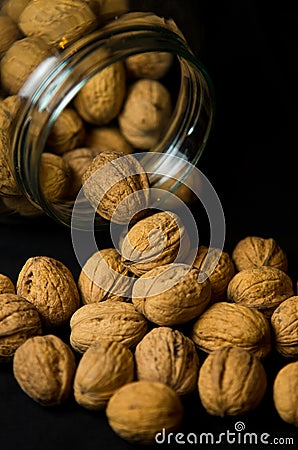 Walnuts in jar Stock Photo