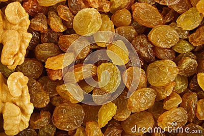 Walnuts on raisins background Stock Photo