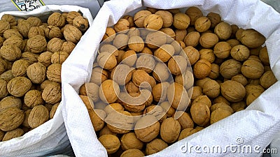 Walnuts for sale in the local farmer market. Nuts for healthy fitness super food. Natural organic product concept. Agricultural fa Stock Photo