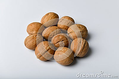 Walnuts on a white background. Close up view of walnuts. Walnuts are 4 water, 15 protein, 65 fat and 14 carbohydrates, including 7 Stock Photo