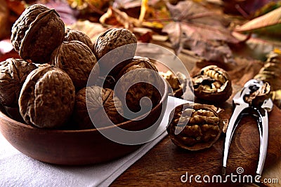 Walnuts in a wooden bowl Stock Photo