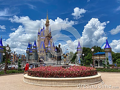 The Walt Disney and Mickey Mouse partner statue in front of Cinderella`s castle in Magic Kingdom Editorial Stock Photo