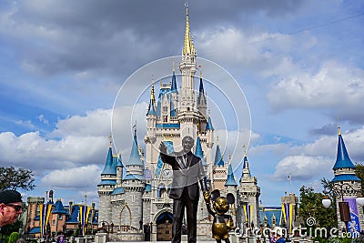Walt Disney and Mickey Mouse Partners statue in front of Cinderellas Castle Editorial Stock Photo