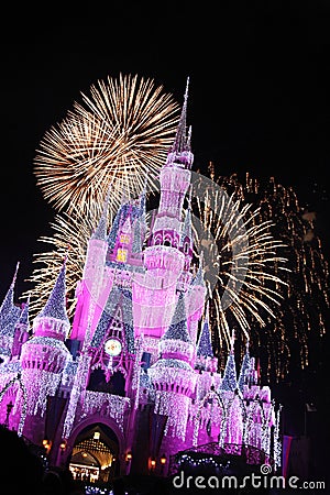 Walt Disney World Cinderella`s Castle with Fireworks and Christmas Lights at night Editorial Stock Photo