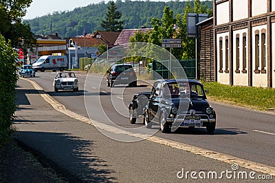 Fiat-Giannini 500 TVL with a trailer drives down the street of a German city. Editorial Stock Photo