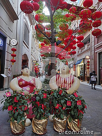 View of decorative lanterns hanging between buildings welcoming Chinese New Year on Lee Tung Avenue, Wan Chai, Hong Kong. Editorial Stock Photo