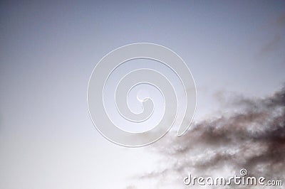 Waning Gibbous moon with dark clouds Stock Photo