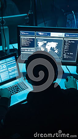 Wanted hackers coding virus ransomware using laptops and computers. Cyber attack, system breaking and malware concept. Stock Photo