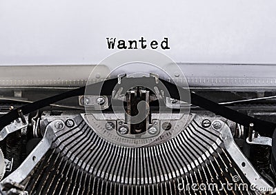 Wanted message typed on a old vintage typewriter. Stock Photo