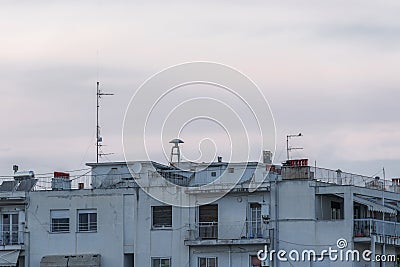 War air raid siren on residential buildings rooftop. Stock Photo