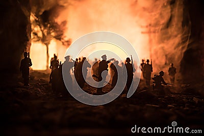 War Concept. Military silhouettes fighting scene on war fog sky background, World War Soldiers Silhouette Below Cloudy Skyline At Stock Photo