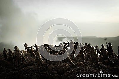 War Concept. Military silhouettes fighting scene on war fog sky background, World War Soldiers Silhouettes Below Cloudy Skyline At Stock Photo