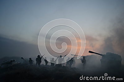 War Concept. Military silhouettes fighting scene on war fog sky background, World War Soldiers Silhouettes Below Cloudy Skyline At Stock Photo