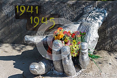 War memorial, hand with flowers. Monument of the Great Patriotic War 1941-1945 in the military town of Balabanovo-1 Editorial Stock Photo