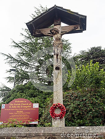 War memorial outside The Parish Church of Saint John the Evangelist, Bovey Tracey, Devon Editorial Stock Photo
